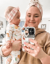 Mom and baby girl are wearing a mommy and me pink gingham headband set from By Bella Boutique.